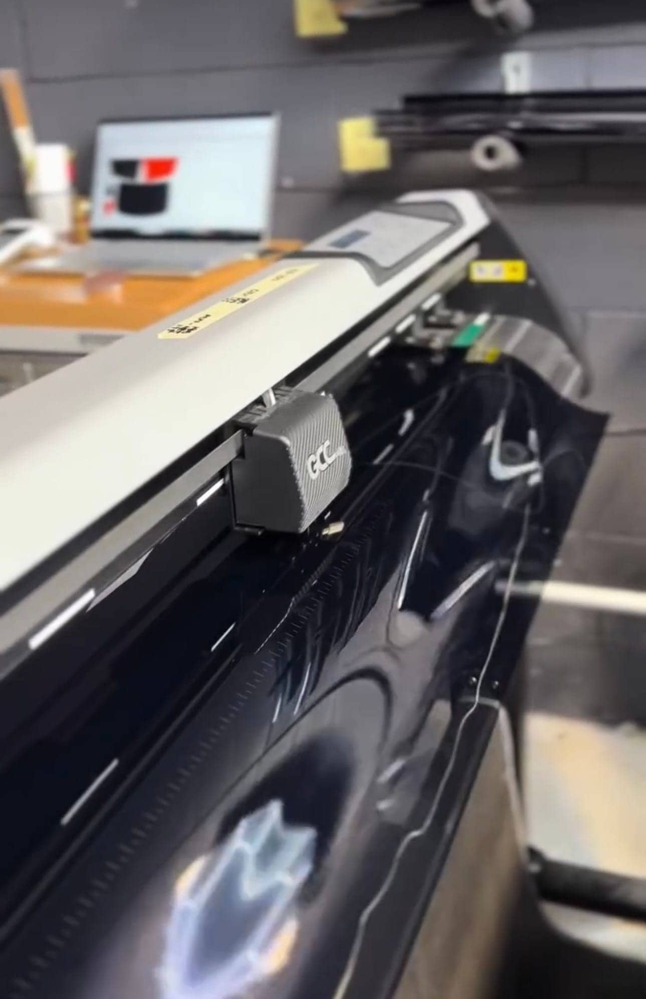 Film being cut on the plotter in the Equinox Tinting prep room